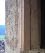 Trowelled wall, ready for the next coat of straw bale render.