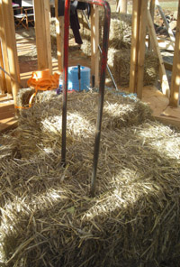 The baling needle, ready to 'split' a bale before inserting into a strawbale wall.
