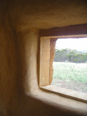 A beautiful view, inside and out! Finished internal strawbale wall.