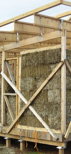 First walls constructed from straw bales on site outside of Melbourne, Australia.